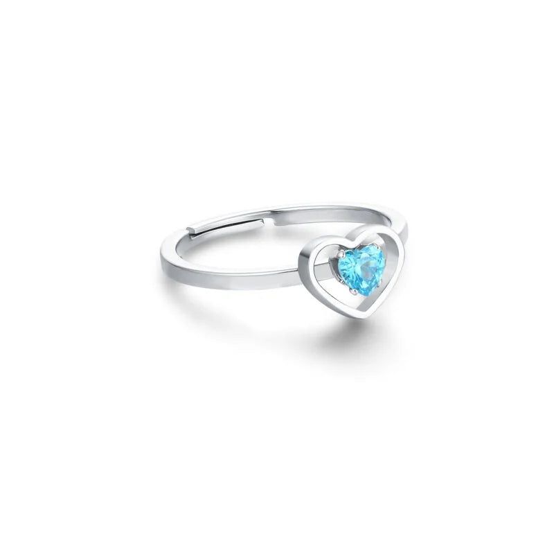 Anello con cristallo azzurro racchiuso in un cuore acciaio